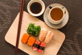 Sushi set with chop sticks and soy sauce served on wooden slate Royalty Free Stock Photo