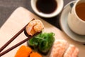 Sushi set with chop sticks, wasabi served on wooden slate, selective focus Royalty Free Stock Photo