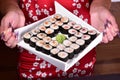 Sushi set compositionally located on a dark surface. Royalty Free Stock Photo