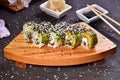 Sushi set compositionally located on a dark surface. Royalty Free Stock Photo