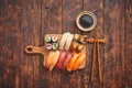 Sushi Set. Different kinds of sushi rolls on wooden serving board Royalty Free Stock Photo