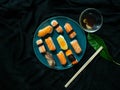 Sushi set on dish with Shrimp Sweet egg Salmon Crab stick Saba,Japanese food is good health,Color black background,Black cloth fou Royalty Free Stock Photo