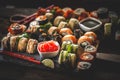 Sushi set food photo. Rolls served on brown wooden and slate plate. Close up of sushi. Modern toning image Royalty Free Stock Photo