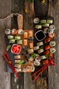 Sushi set food photo. Rolls served on brown wooden and slate plate. Close up and top view of sushi Royalty Free Stock Photo