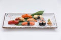 Sushi Set Include Maguro, Hamachi, Salmon, Kani, Shrimp and Tamago Maki with Salmon Maki Rolls.