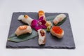 Sushi Set Include Torched Salmon, Engawa, Hotate, Hamachi, Tai and Ikura with Hirame Served with Wasabi and Prickled Ginger.