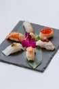 Sushi Set Include Torched Salmon, Engawa, Hotate, Hamachi, Tai and Ikura with Hirame Served with Wasabi and Prickled Ginger. Royalty Free Stock Photo