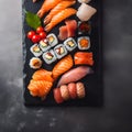 Japanese food concept. Catering, various kinds of sushi on plate or platter set. Chopsticks, ginger, soy sauce, wasabi. Placed on Royalty Free Stock Photo