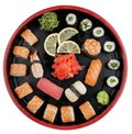 Sushi Set nigiri, rolls and sashimi served in traditional Japan black Sushioke round plate. On white background Royalty Free Stock Photo