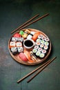 Sushi set nigiri and rolls served in round plate Royalty Free Stock Photo