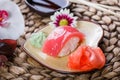 Sushi Set nigiri and sushi rolls decorated with flowers on bamboo background. Japanese cuisine. Royalty Free Stock Photo