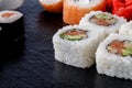 Sushi Set nigiri, sushi rolls and sashimi served on stone slate Royalty Free Stock Photo