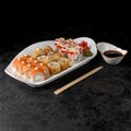 sushi set Okinawa. Rolls Philadelphia light, Rolls Tempura with eel, Rolls Tempura with salmon and California Royalty Free Stock Photo