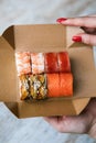 sushi set on packing box in hand