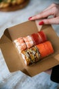 sushi set on packing box in hand