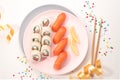 Sushi set on a pink plate on bright background. Philadelphia maki roll and salmon sashimi nigiri. Festive mood Royalty Free Stock Photo