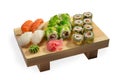 Sushi set and sushi roll on wooden board