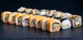 sushi set rolls with salmon eel cheese cucumber rice sauce sesame caviar