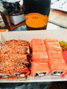 Sushi Set of sashimi and sushi rolls, bottle of wine