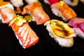 Sushi Set Sashimi and sushi rolls served on black stone slate. Royalty Free Stock Photo