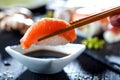 Sushi Set sashimi and sushi rolls served on stone slate. Royalty Free Stock Photo