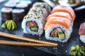 Sushi Set sashimi and sushi rolls served on stone slate. Royalty Free Stock Photo