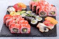 Sushi Set sashimi and sushi rolls served on stone slate Royalty Free Stock Photo