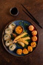 Sushi Set, Sashimi, Rolls Set on Table. Asian Cuisine. Healthy Food. Wakame Salat and Sushi Sticks Royalty Free Stock Photo