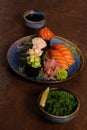 Sushi Set, Sashimi, Rolls Set on Table. Asian Cuisine. Healthy Food. Wakame Salat, Soya Souce and Sushi Sticks Royalty Free Stock Photo