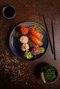 Sushi Set, Sashimi, Rolls Set on Table. Asian Cuisine. Healthy Food. Wakame Salat, Soya Souce and Sushi Sticks Royalty Free Stock Photo