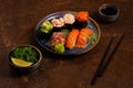 Sushi Set, Sashimi, Rolls Set on Table. Asian Cuisine. Healthy Food. Wakame Salat and Sushi Sticks Royalty Free Stock Photo