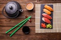 Sushi Set served on gray stone slate with soy sauce, grey teapot and cup of tea Royalty Free Stock Photo