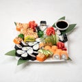 Sushi Set, serving plate of rolls on white background. Traditional Japanese food. Healthy Oriental meal. Wellness Royalty Free Stock Photo