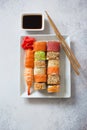 Sushi set, soy sauce and chopsticks on grey stone background Royalty Free Stock Photo