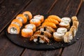 Sushi set from top on black background. An assortment of various maki nigiri and rolls seafood soy sauce Royalty Free Stock Photo