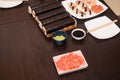 sushi set with sauce and wooden sticks on the brown table Royalty Free Stock Photo