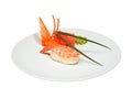 Sushi with shrimps and pickled ginger and wasabi on white round plate