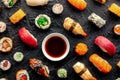 Sushi with soy sauce. An assortment of rolls, maki, nigiri etc, overhead