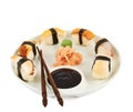 Sushi with soy sauce on a plate