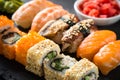 Sushi and sushi roll set on black stone table. Royalty Free Stock Photo