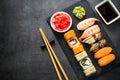 Sushi and sushi roll set on black stone table top view Royalty Free Stock Photo