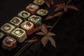 Sushi and sushi rolls, sushi nigiri on stone plate on dark background Royalty Free Stock Photo