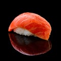 Sushi Syake with salmon on a black background