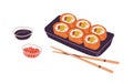 Sushi in takeaway container, chopsticks and sauces. Fresh Asian rolls in delivery box. Japanese take-away food. Japan