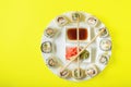 Sushi time in the form of a wall clock on a concrete background. Sushi clock. Place for text Royalty Free Stock Photo