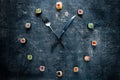 Sushi clock with fork and knife, concept of time to eat Royalty Free Stock Photo