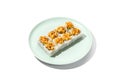 Sushi topped burnt shrimp tartare. Maki sushi with shrimp and spicy sauce on ceramic plate Baked maki roll topped shrimp tartare Royalty Free Stock Photo