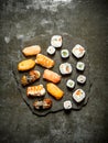 Sushi with tuna, shrimp, salmon and rolls. Royalty Free Stock Photo