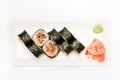 Sushi with tuna wrapped in nori on a white plate Royalty Free Stock Photo