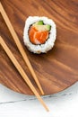 Sushi uramaki roll with salmon and avocado